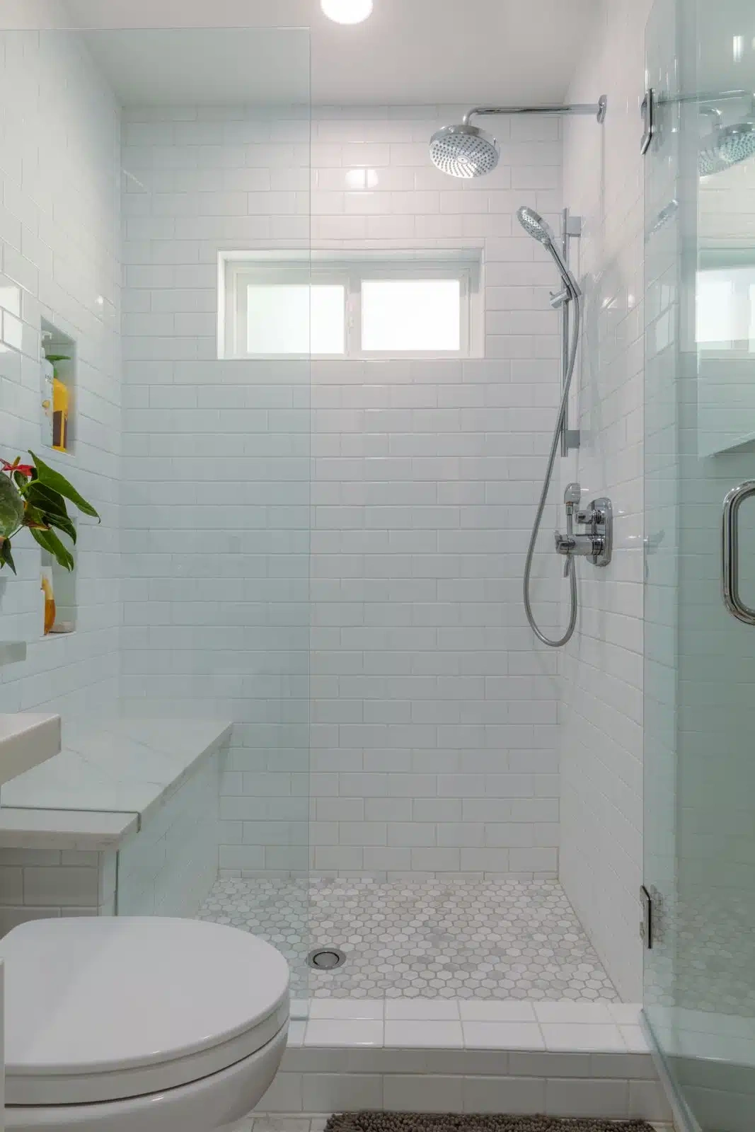 White tile shower renovation by Roy's Builders and Remodeling