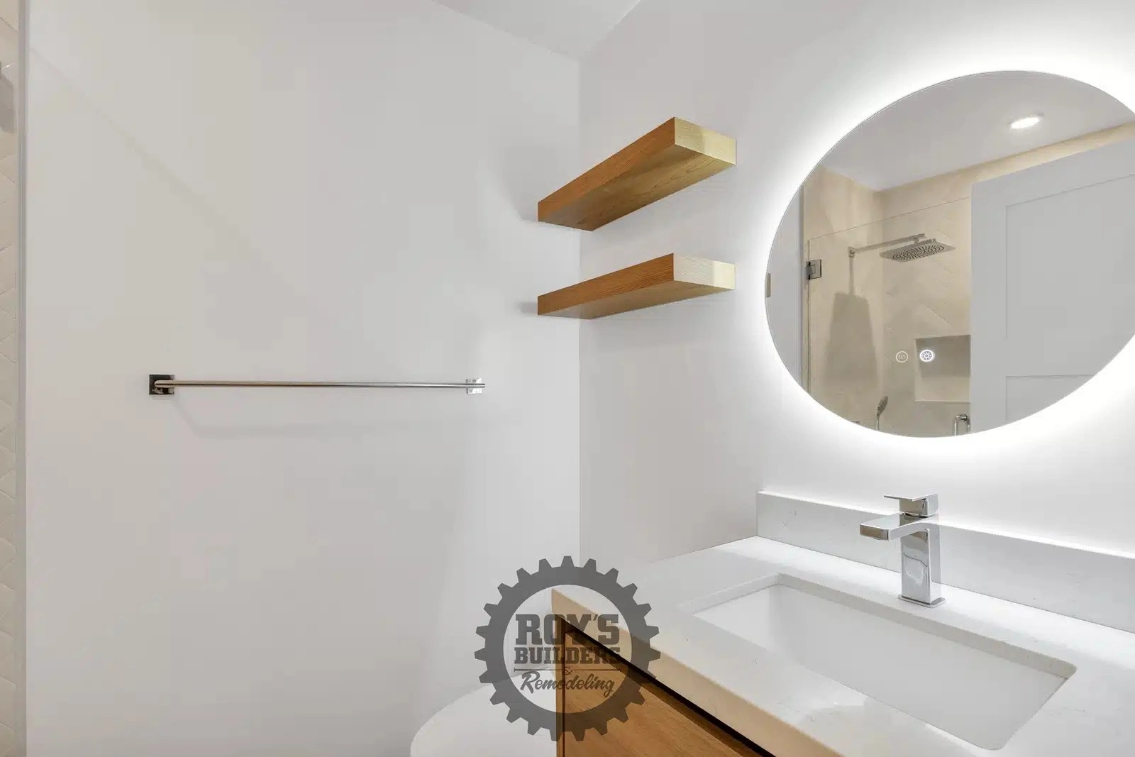 Contemporary Bathroom Remodel with Round Mirror- Roy's Builders