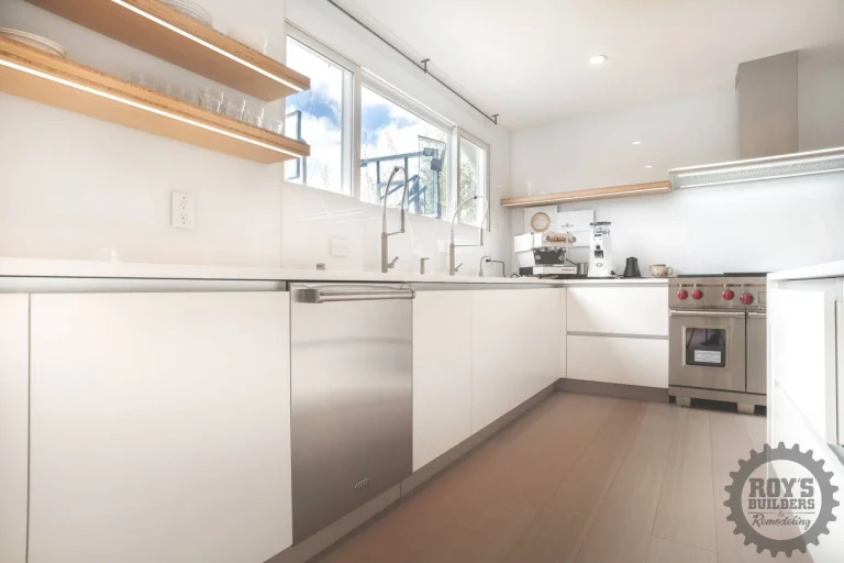 Minimalist White Kitchen With Wood Accents