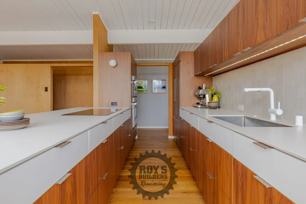 Modern Galley Kitchen With Walnut Cabinets- Roy's Builders and Remodeling