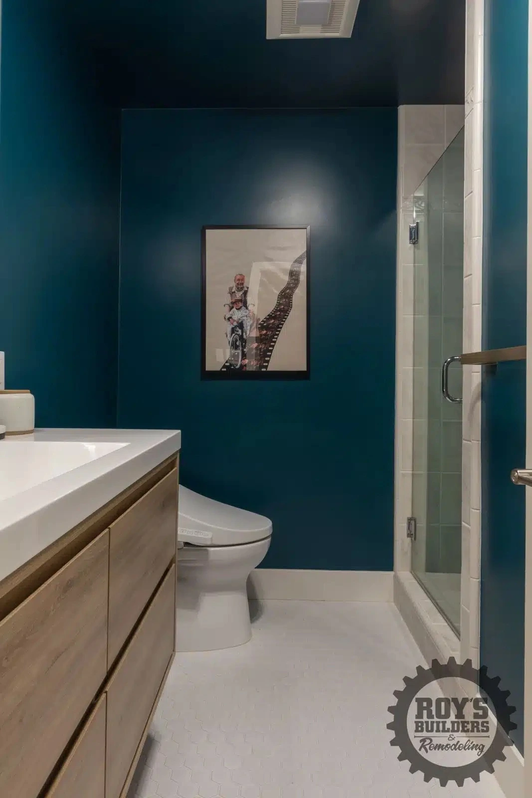 Newly remodeled bathroom teal accent- Roy's Builders