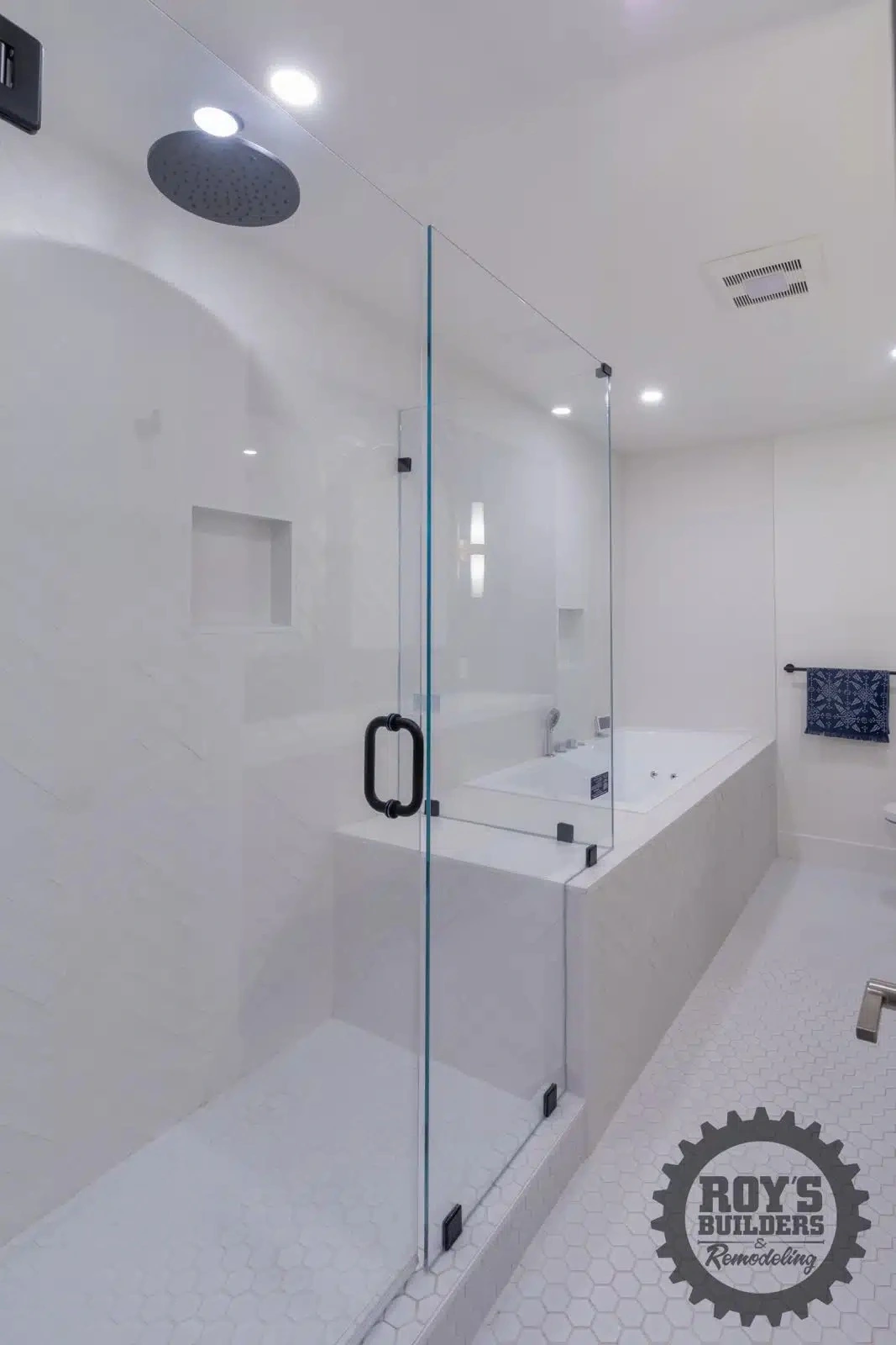 Newly remodeled bathroom white accent- Roy's Builders