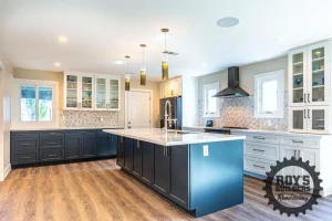Two-Tone Kitchen With Glass Cabinets- Roy's Builders and Remodeling