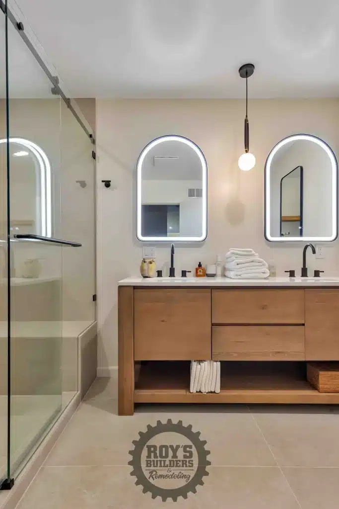 Wood vanity with arched backlit mirrors