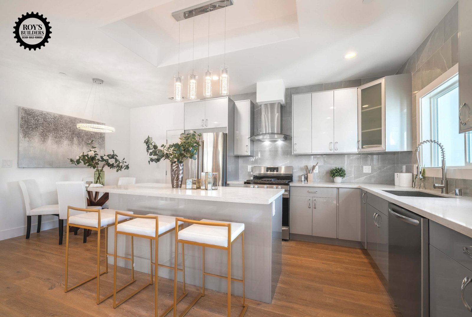 Spacious kitchen with bar seating and pendant lights