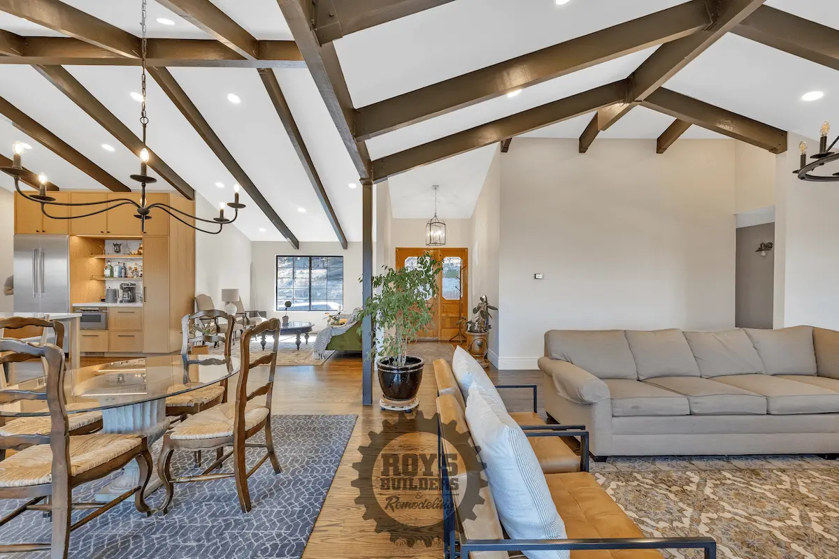 Spacious living room with vaulted beams and seating