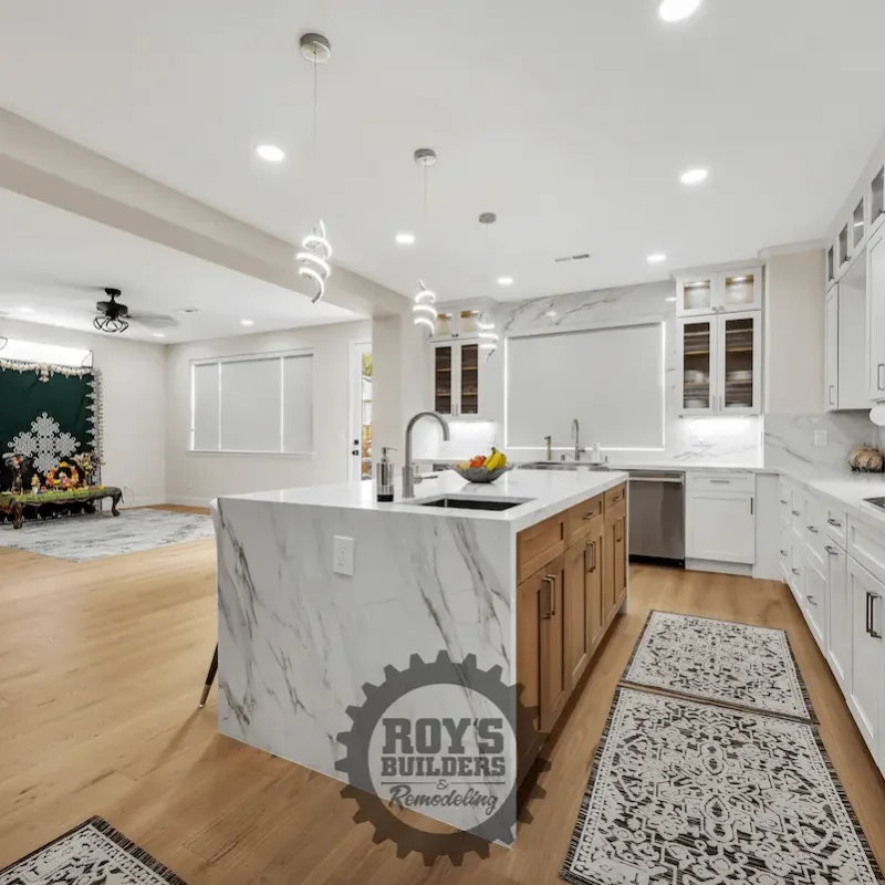 Kitchen with wooden cabinetry and marble counters