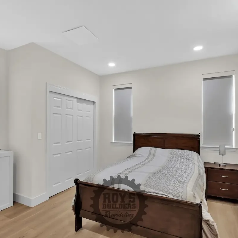Cozy bedroom with bed and white walls