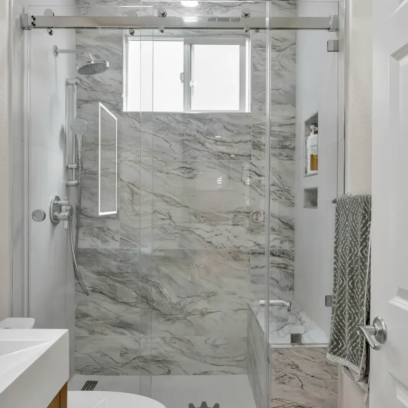 Shower with glass walls and luxurious tiles