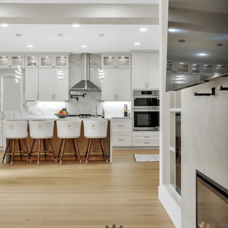 Bright kitchen with wooden dining table and stools