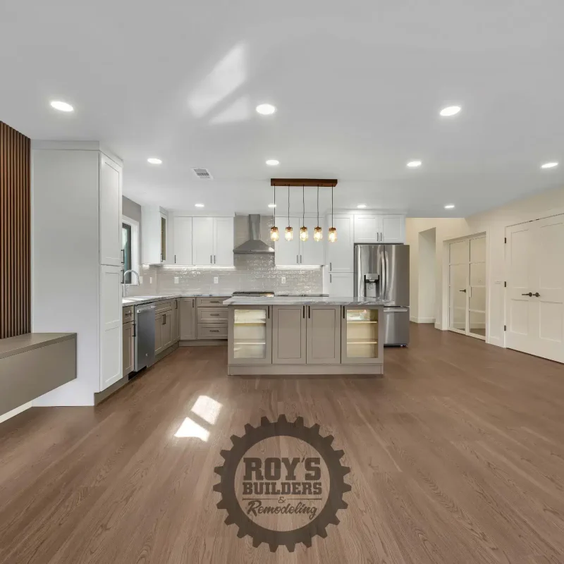 Bright open-concept floor plan combining the kitchen and living areas.