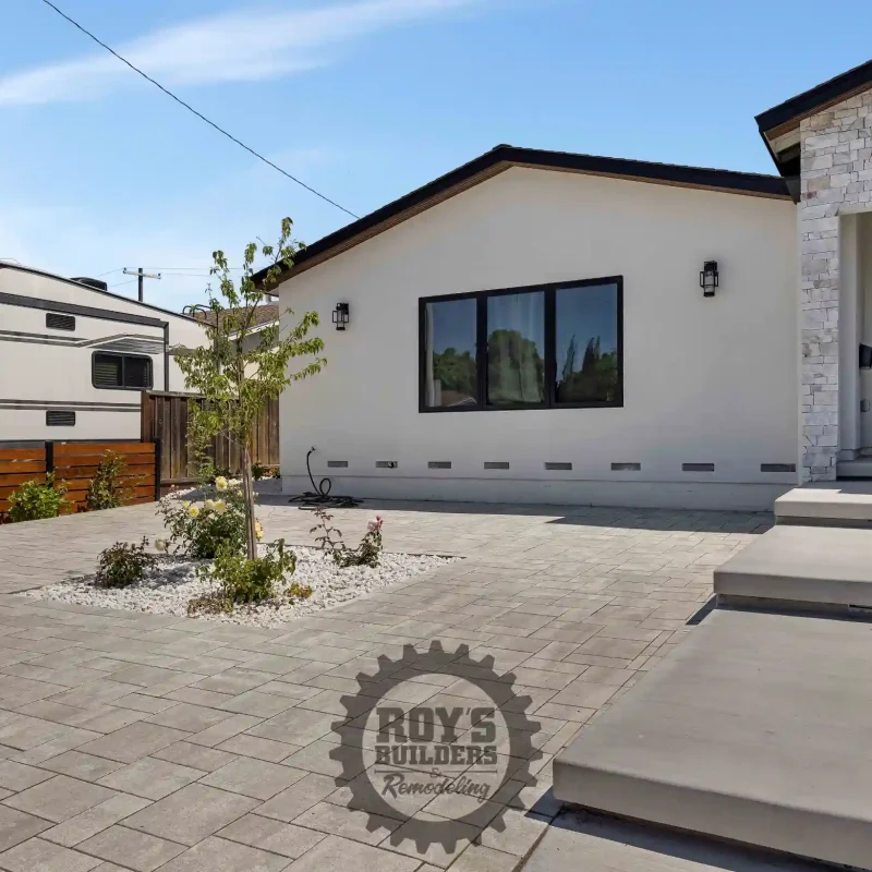 Full view of a front yard completely designed with interlocking pavers.