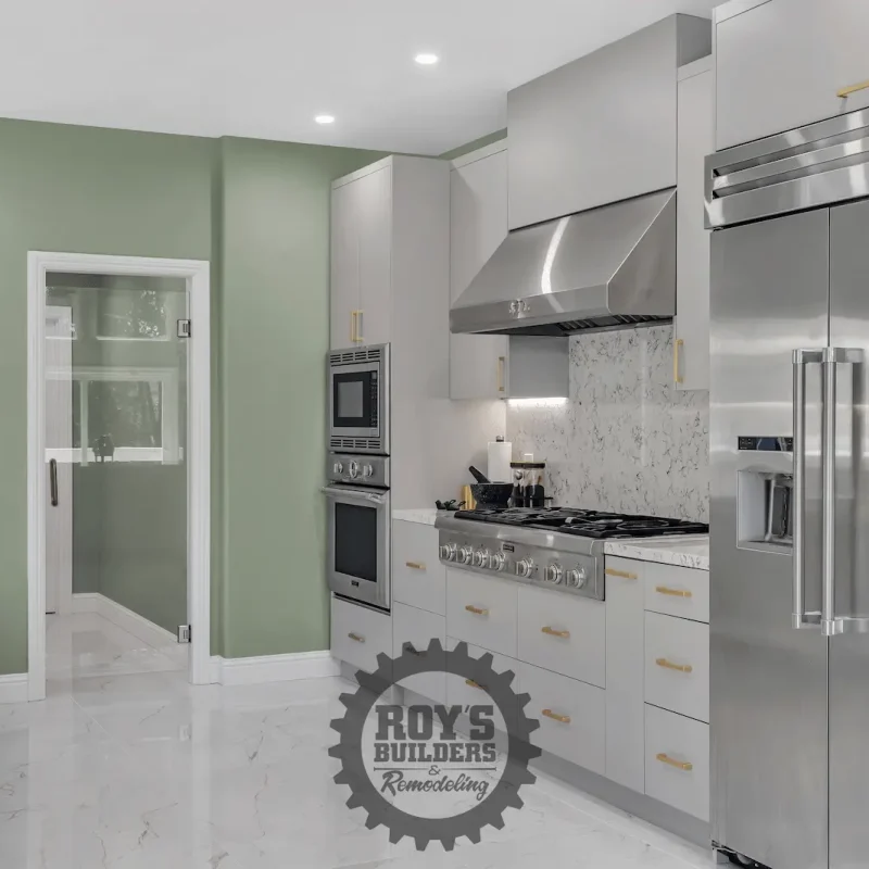 Stylish kitchen featuring double ovens