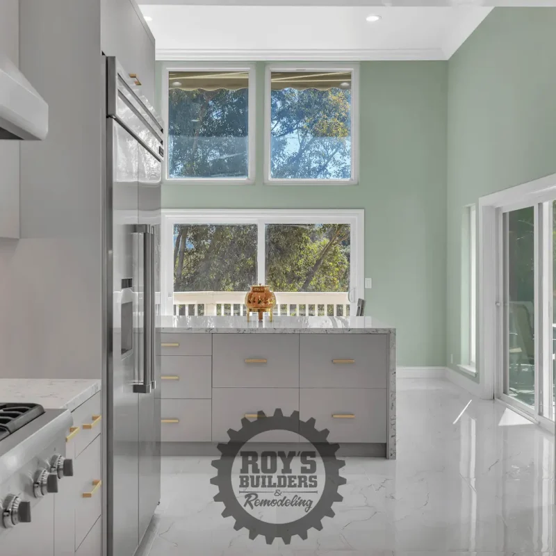 Kitchen island and tall gray cabinets