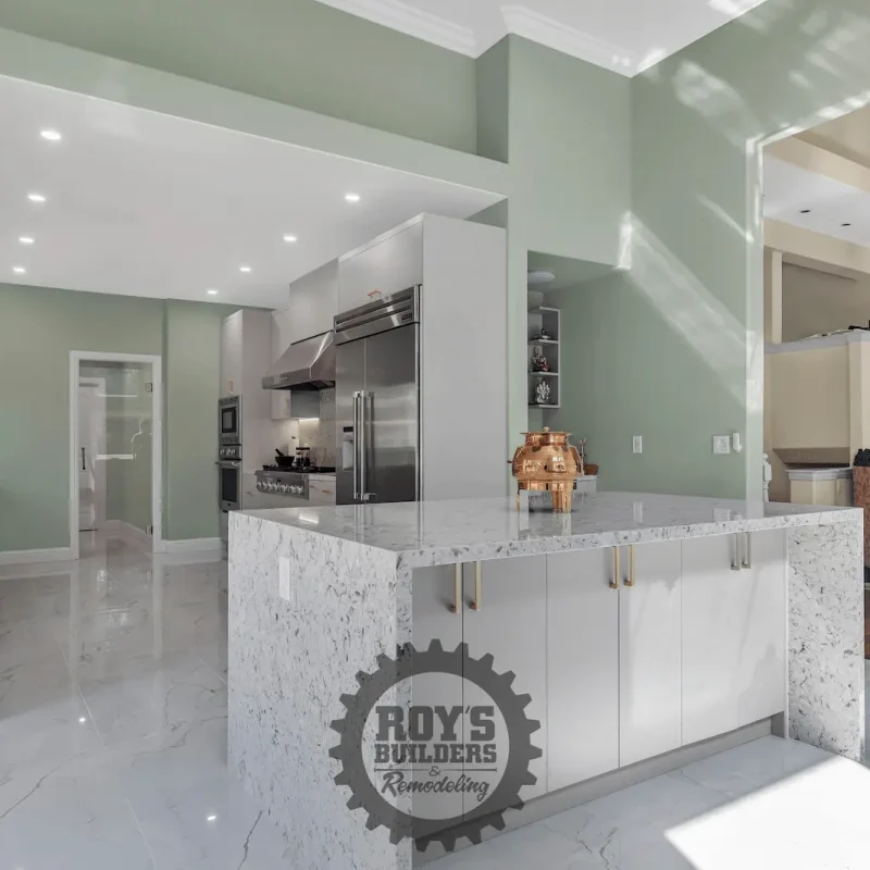 Modern kitchen with green walls and island