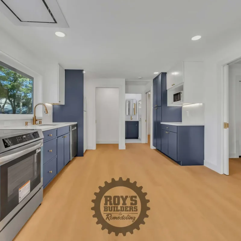 Long view across the kitchen towards an open doorway leading to another room.