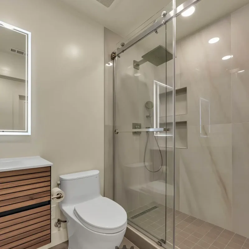Contemporary bathroom design with a glass-enclosed walk-in shower.