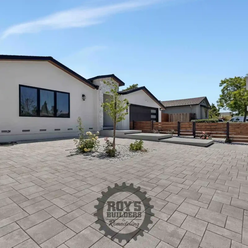 Landscaped front yard of a modern home with low-maintenance plants.