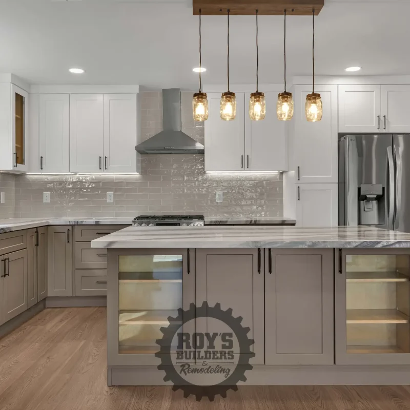 Contemporary kitchen featuring a center island, stainless steel appliances, and pendant lighting.