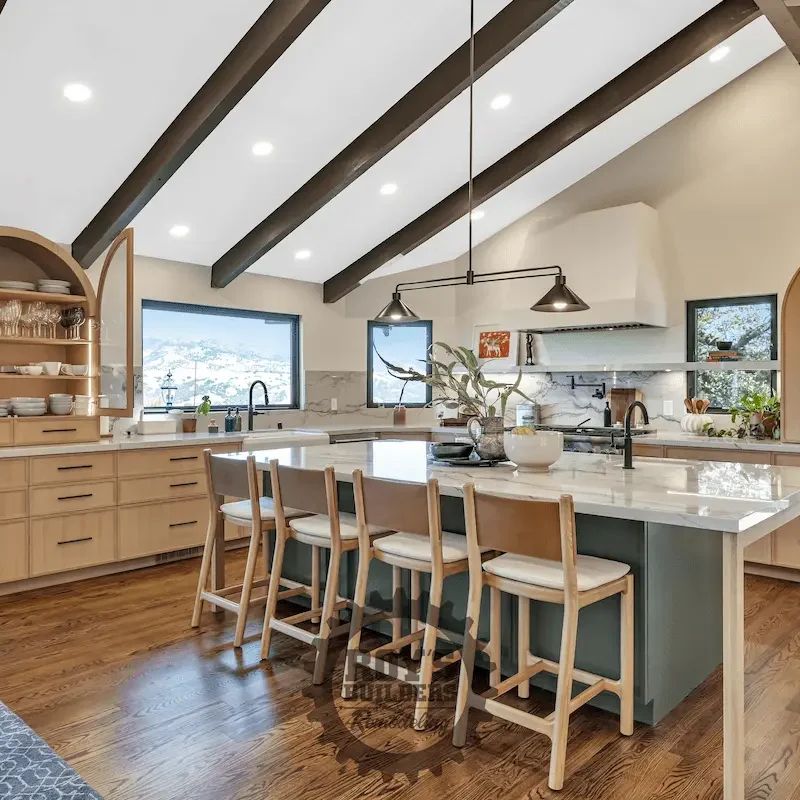 Kitchen with light wood cabinets and island.