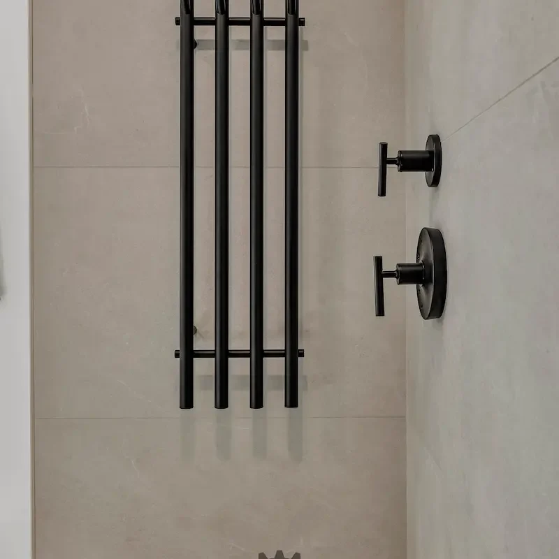Stylish bathroom with minimalist design and fixtures.
