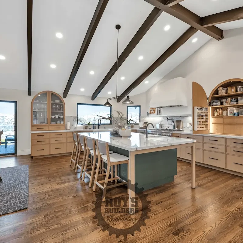 Spacious living room with vaulted wooden ceiling.