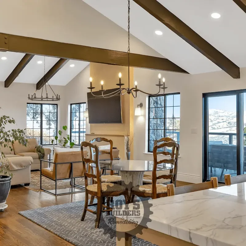 Dining room with wooden chairs and chandelier.