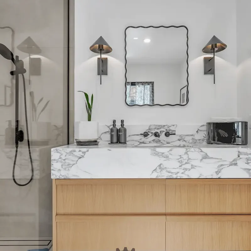 Neutral bathroom with natural wood accents.