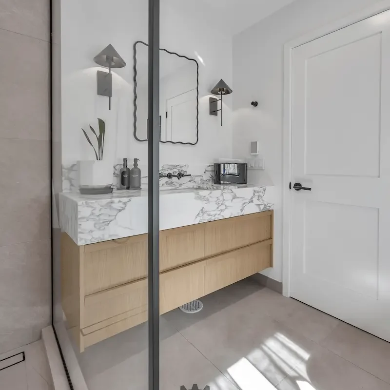 Modern bathroom with marble countertop.