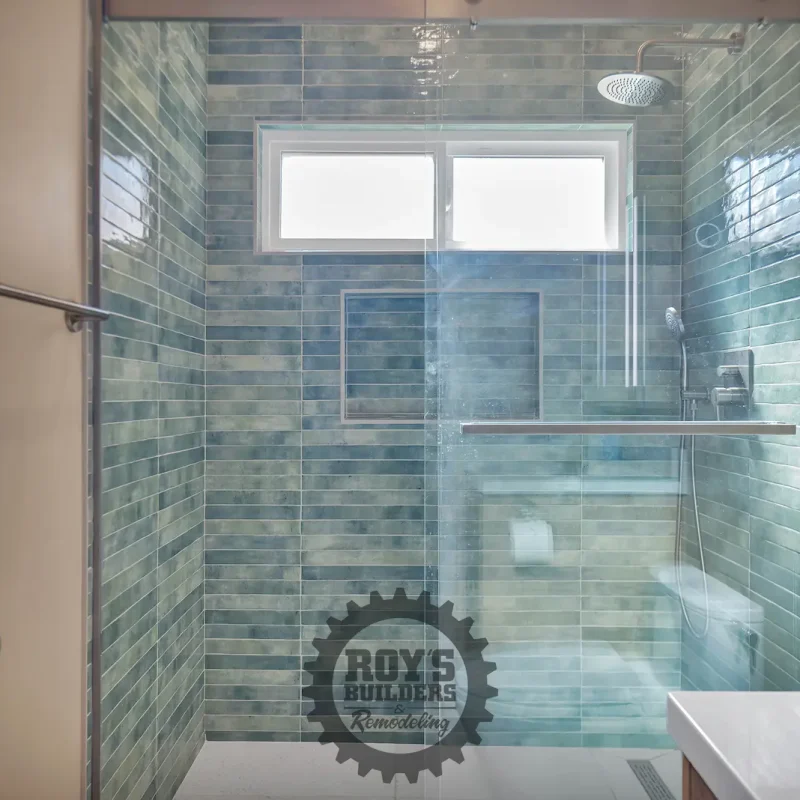 Luxurious bathroom shower with green tiles