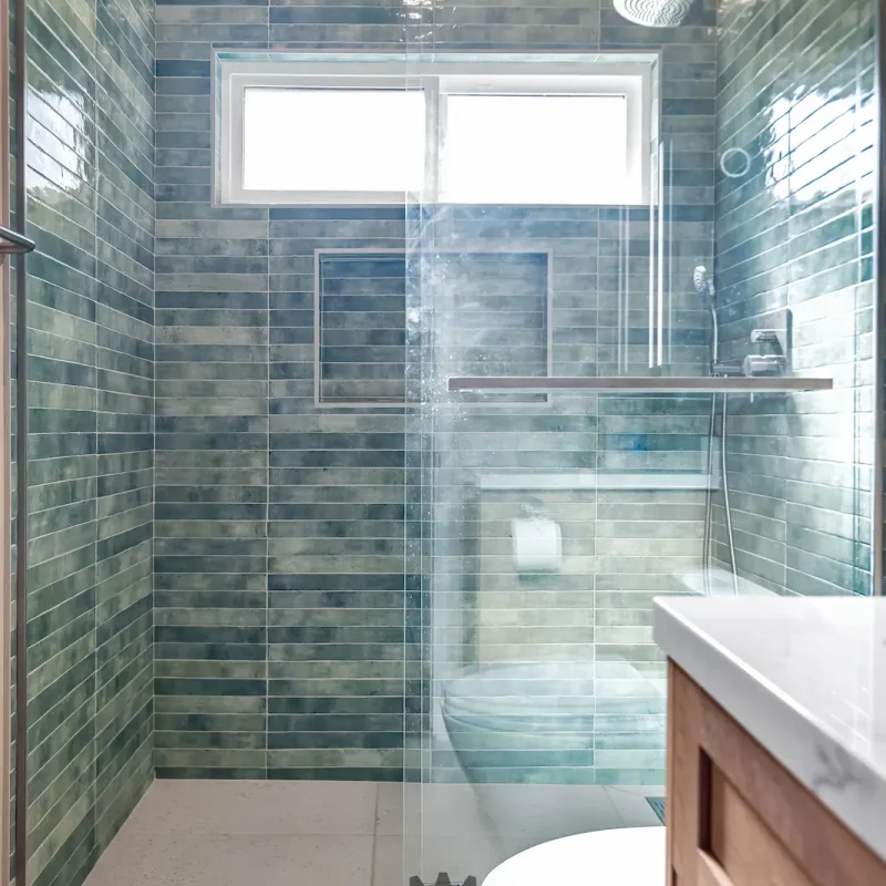 Contemporary glass shower with tile walls