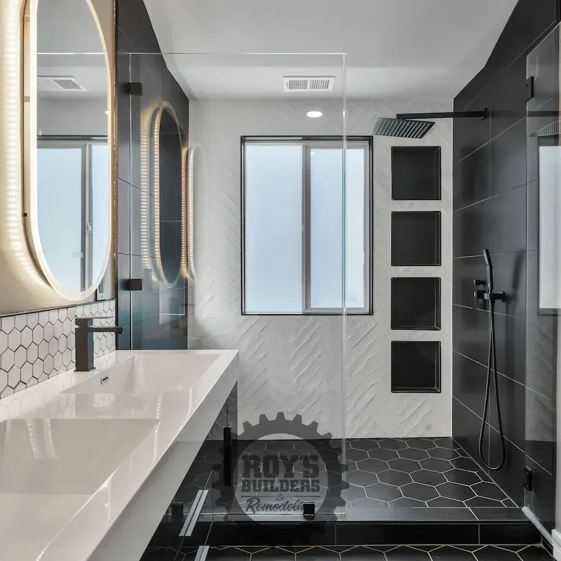 Bright bathroom featuring double sinks and mirrors