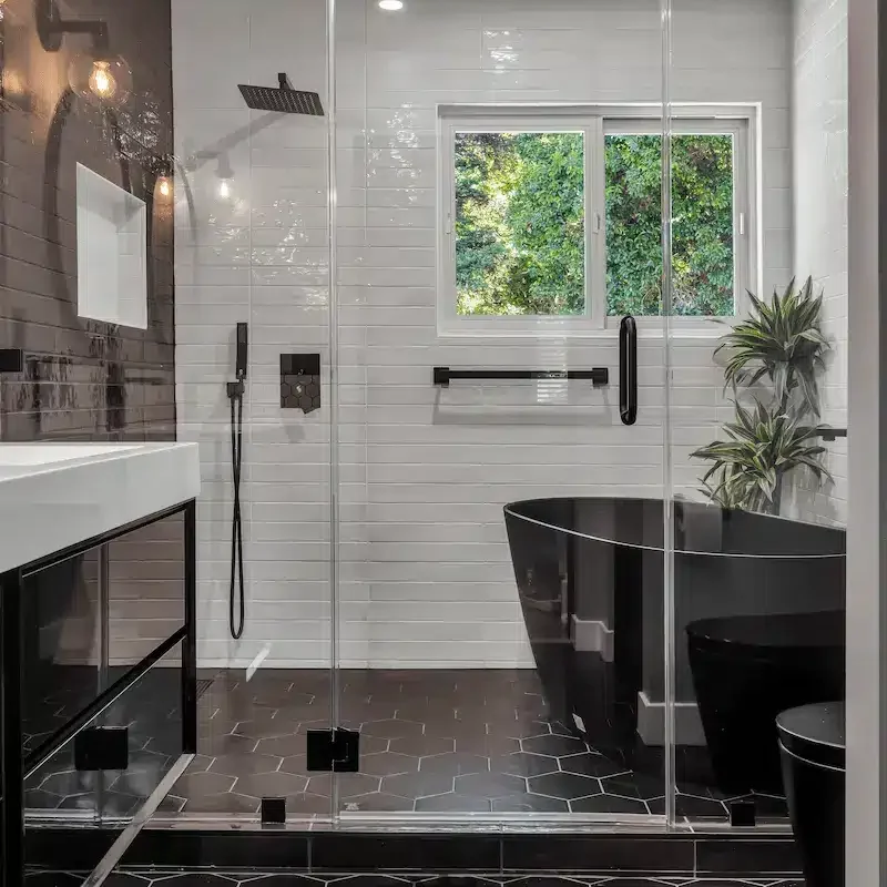 Modern vanity and tub under natural light