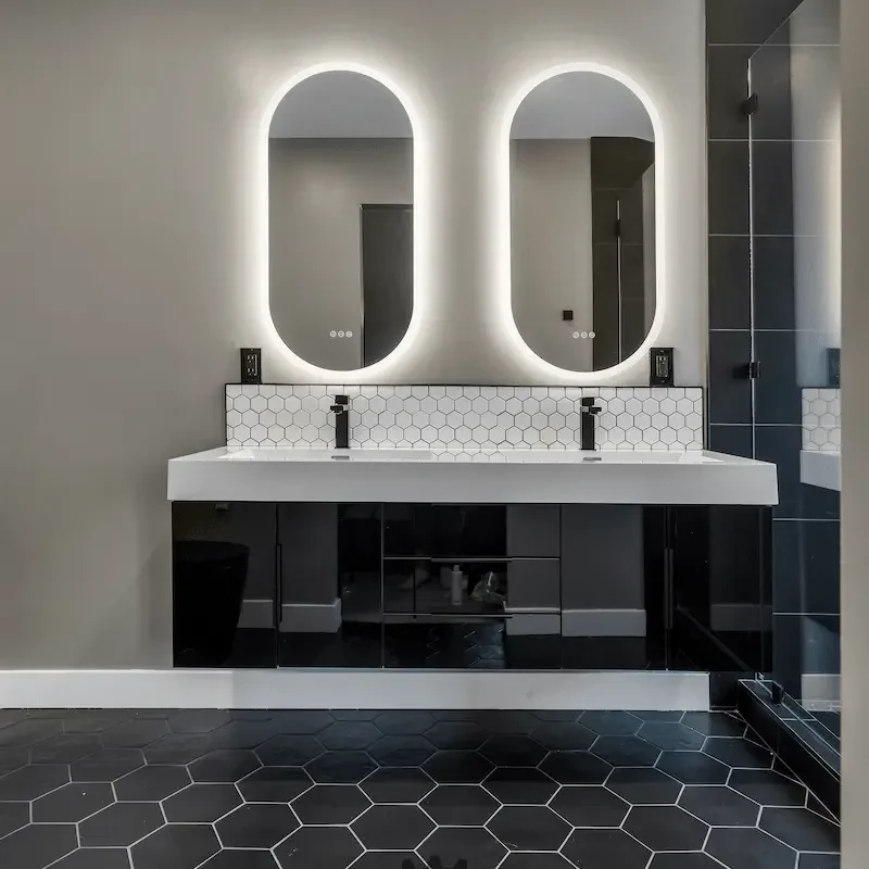 Elegant dual sink vanity with geometric tiles