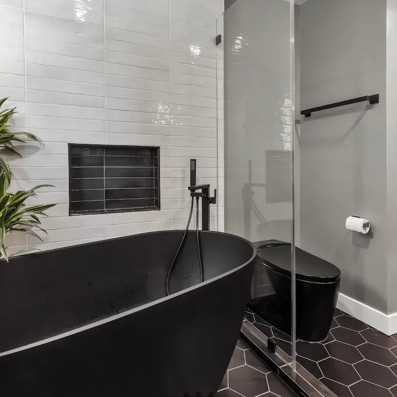 Elegant bathroom with sleek black bathtub