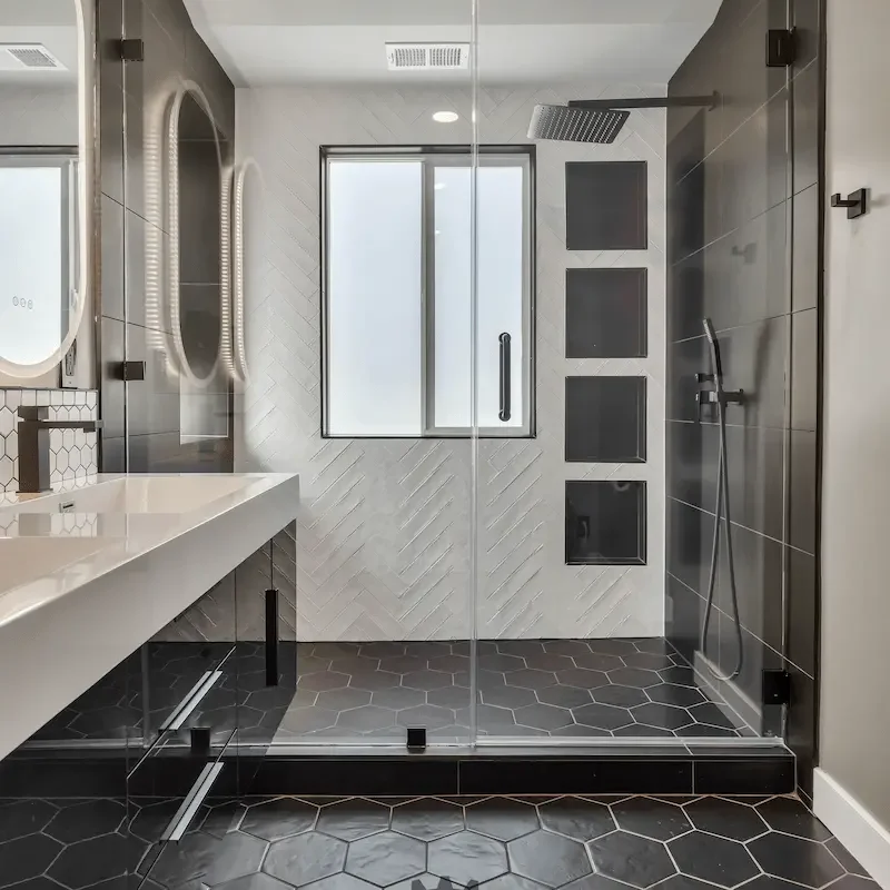Spacious bathroom with bright lighting and tiles