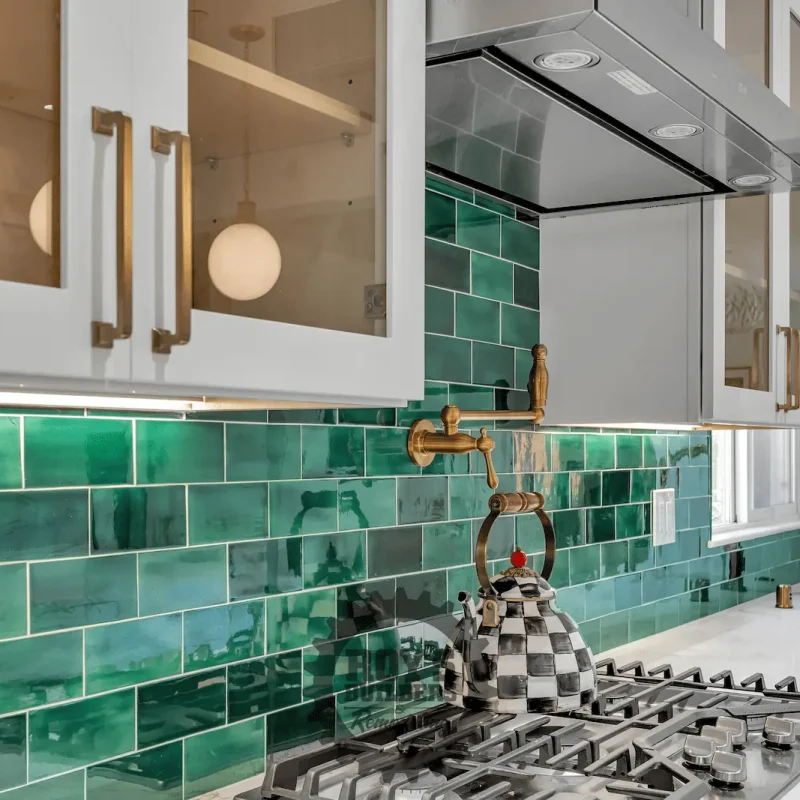 Green tile backsplash and gold fixtures