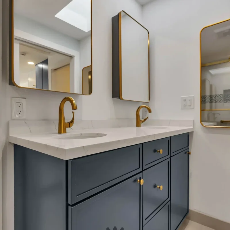 Perspective view of a blue bathroom vanity unit topped with a white countertop.